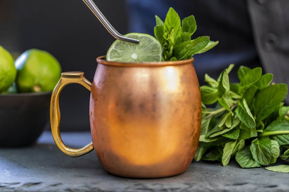 A Moscow mule in a copper mug with lime